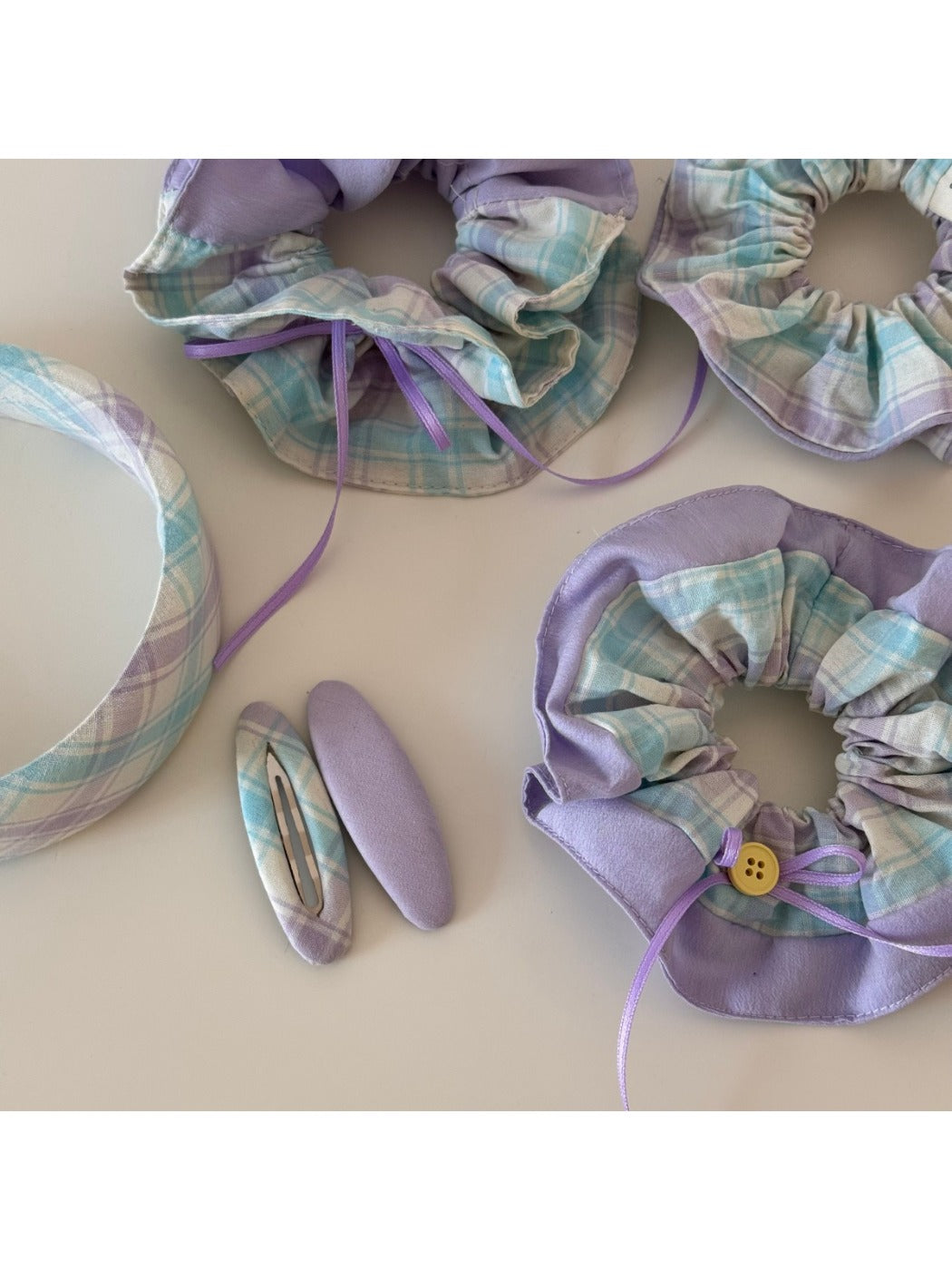 Close-up of Gifty checkered bow ribbon scrunchie fabric texture