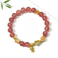 Close-up of goldfish pendant with crystal beads on Lovra bracelet