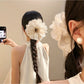 Close-up of Beau vintage pleated hair claw clip showing openwork design