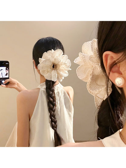 Close-up of Beau vintage pleated hair claw clip showing openwork design