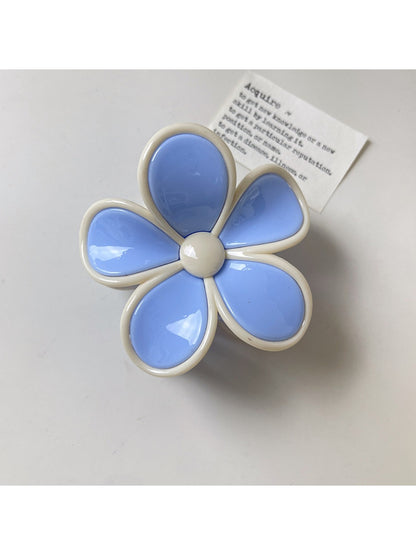 Beau color block flower claw clip with pastel pink and cream petals on neutral background