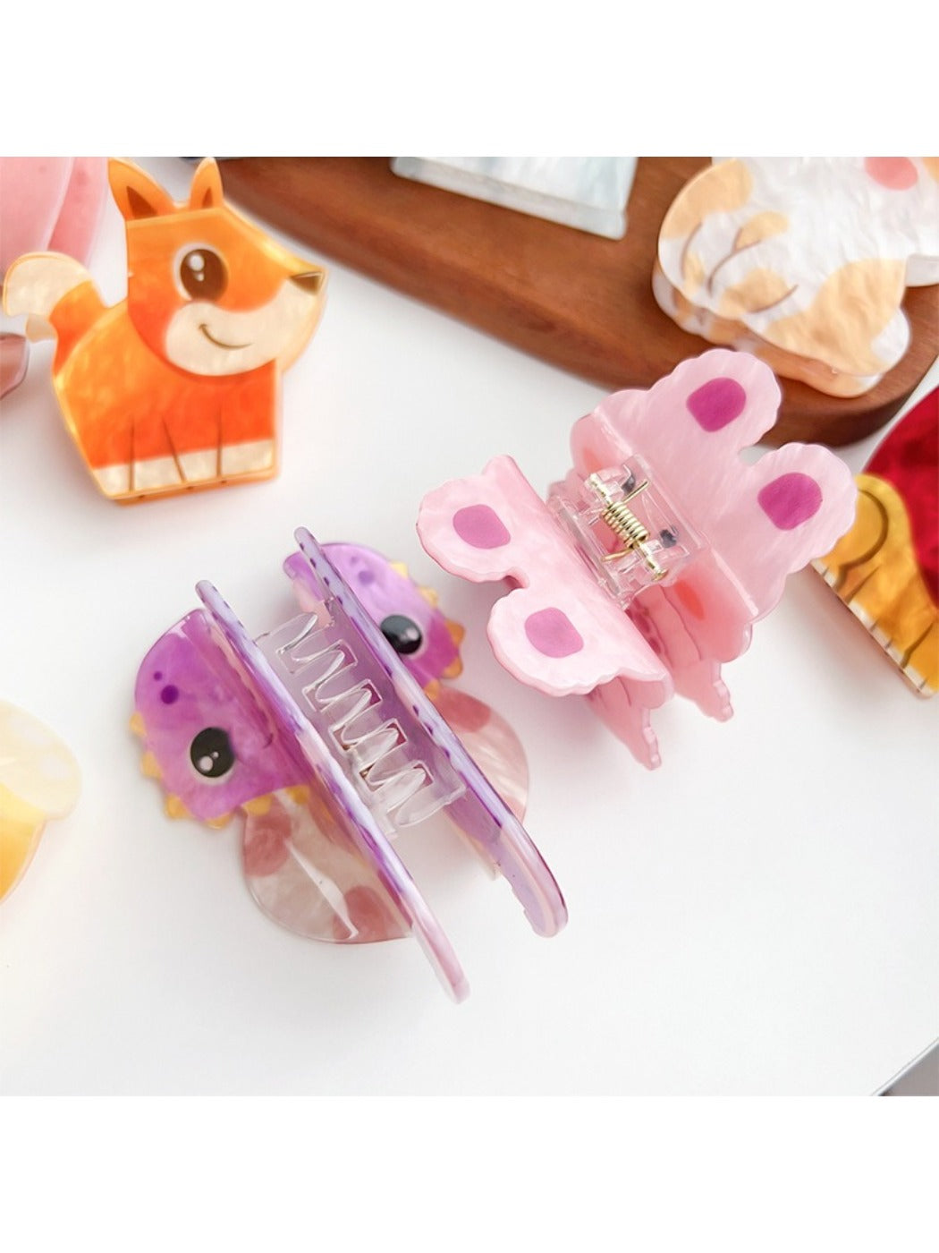 Beau hair claw clip held in hand displaying size and minimalist design