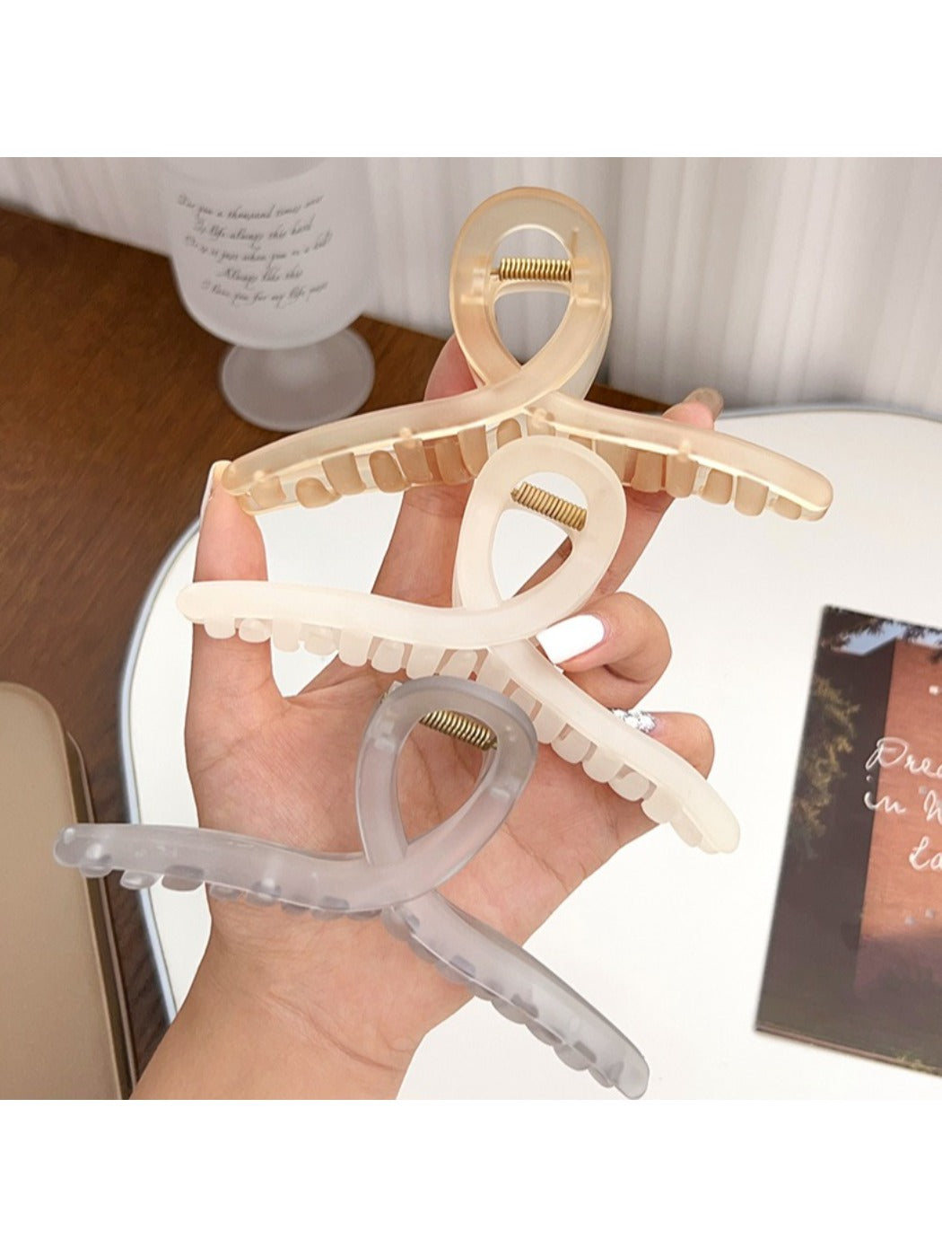 Side angle of Beau square crisscross hair claw clip showing clasp mechanism