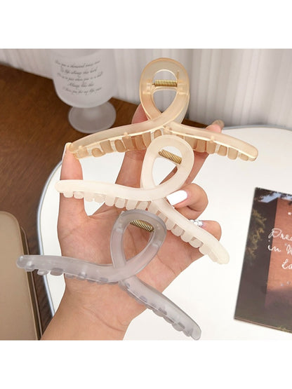 Side angle of Beau square crisscross hair claw clip showing clasp mechanism