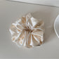 Gifty satin scrunchie packaged in a minimalist branded box