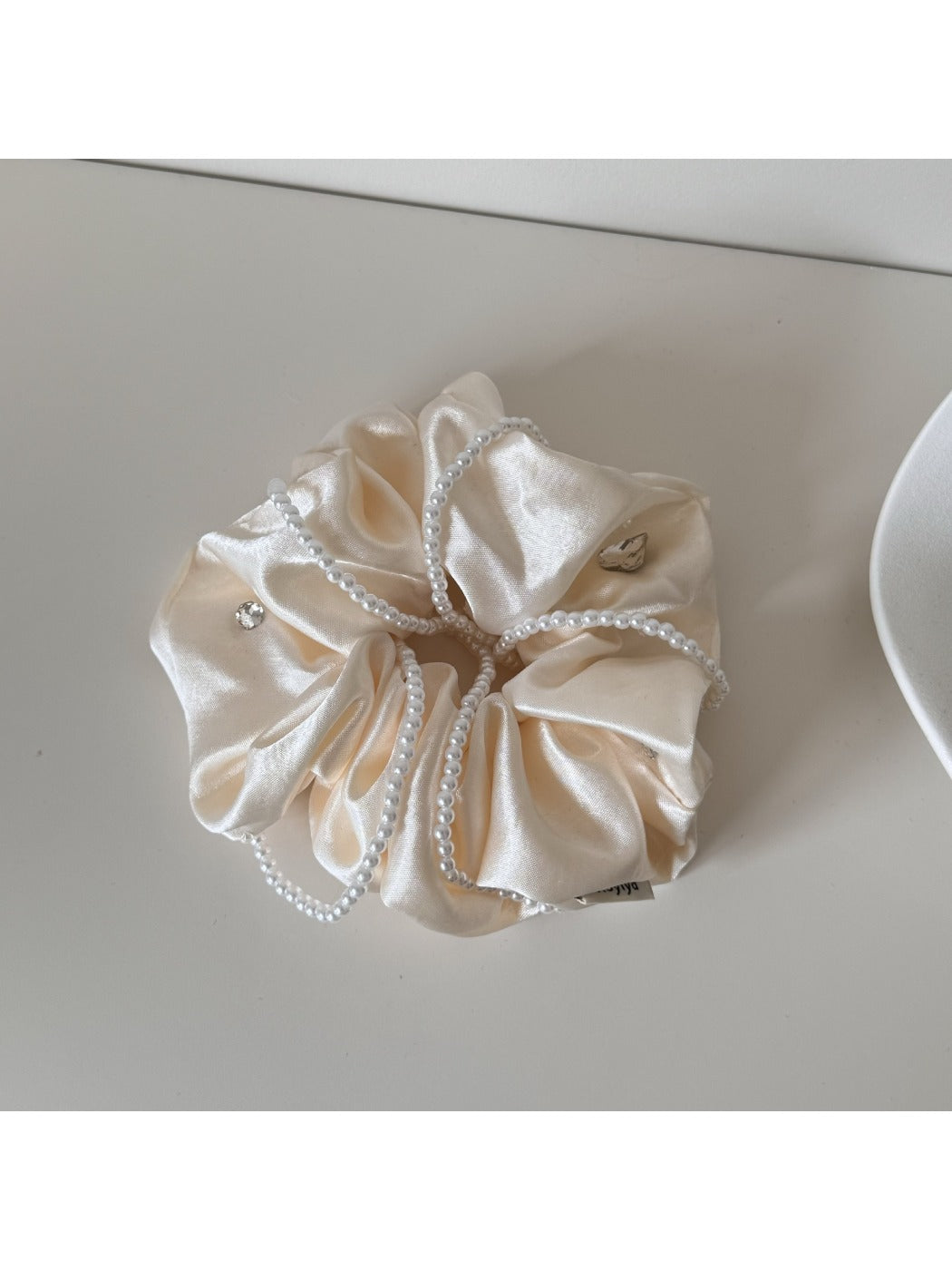 Gifty satin scrunchie packaged in a minimalist branded box