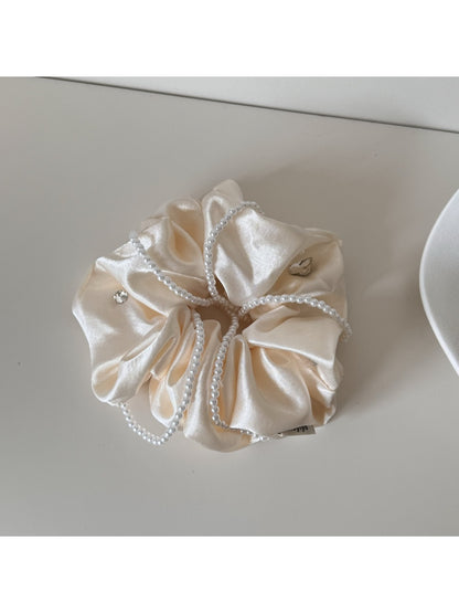 Gifty satin scrunchie packaged in a minimalist branded box
