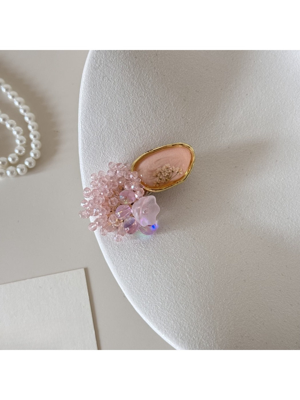 Beau Sweet Pink Beaded Hair Clip shown clipped in light brown hair