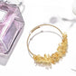 Lovra crystal charm bracelet coiled to show charm variety and design