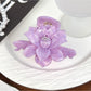 Beau lotus hair claw clip in beige clipped into long brown hair