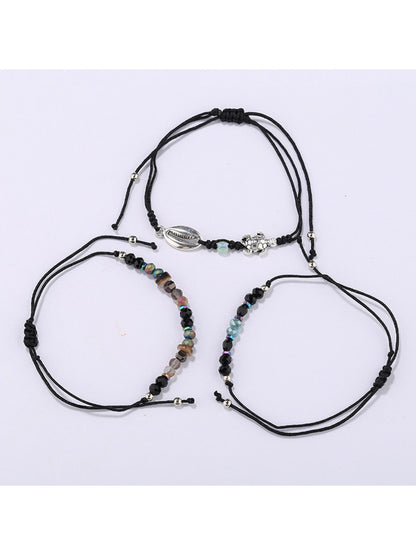 Close-up of Lovra alloy charm small bead bracelet showing detailed charm and bead texture