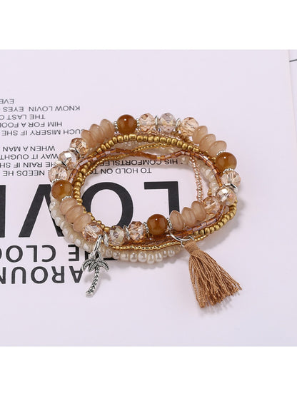 Lovra boho tassel bracelet with wooden and glass beads close-up