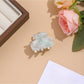 Beau vibrant acetate hair clip angled to show thickness and material texture