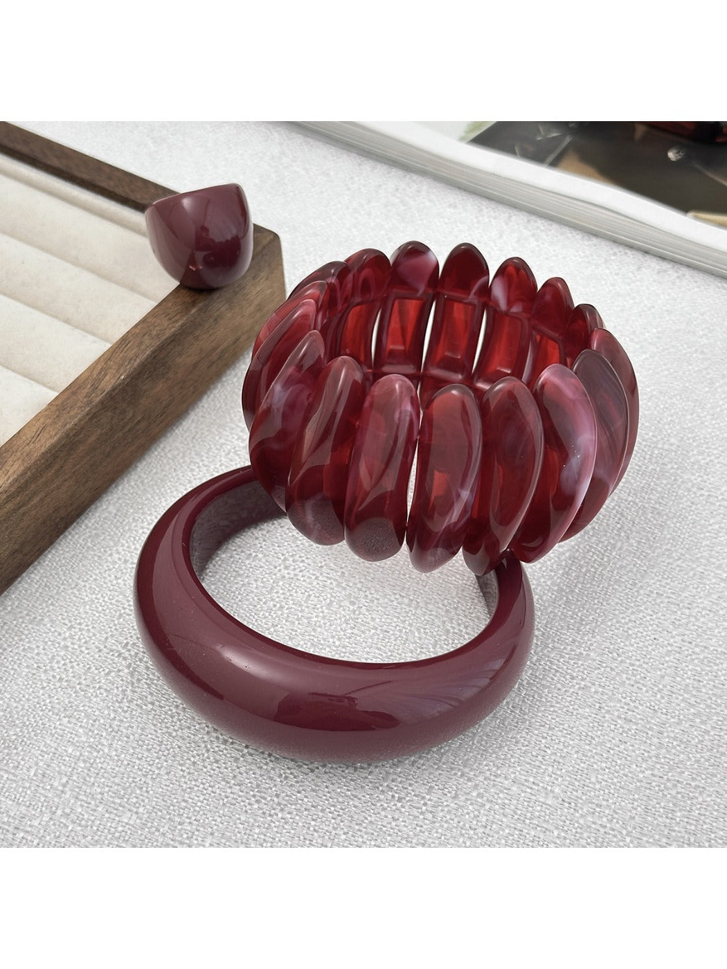 Close-up of Lovra red ombre link ring highlighting color transition and design