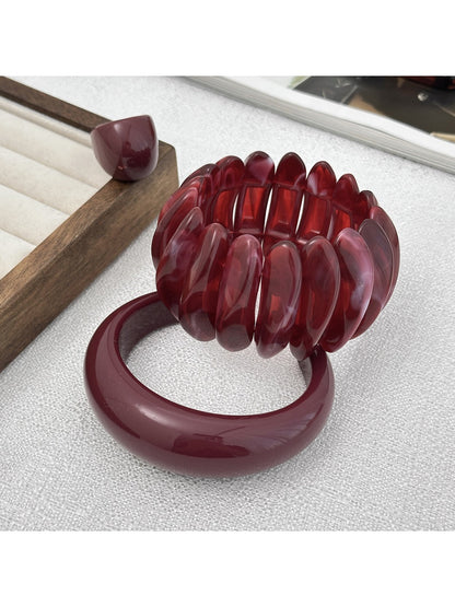 Close-up of Lovra red ombre link ring highlighting color transition and design