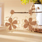 Earedge flower shaped drop earrings photographed with soft lighting