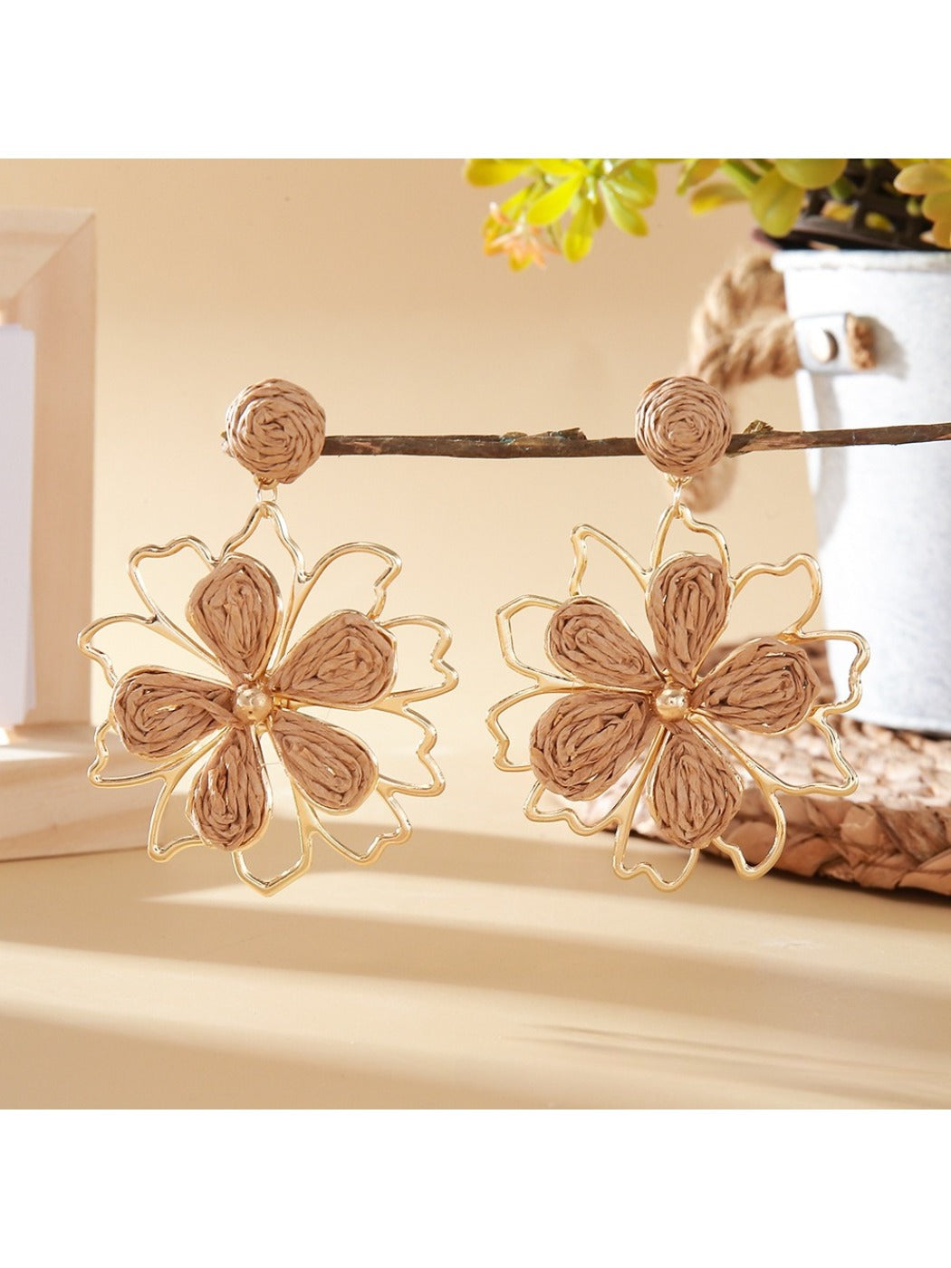 Earedge flower shaped drop earrings photographed with soft lighting