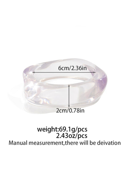Lovra wide band bangle bracelet displayed with matching rings
