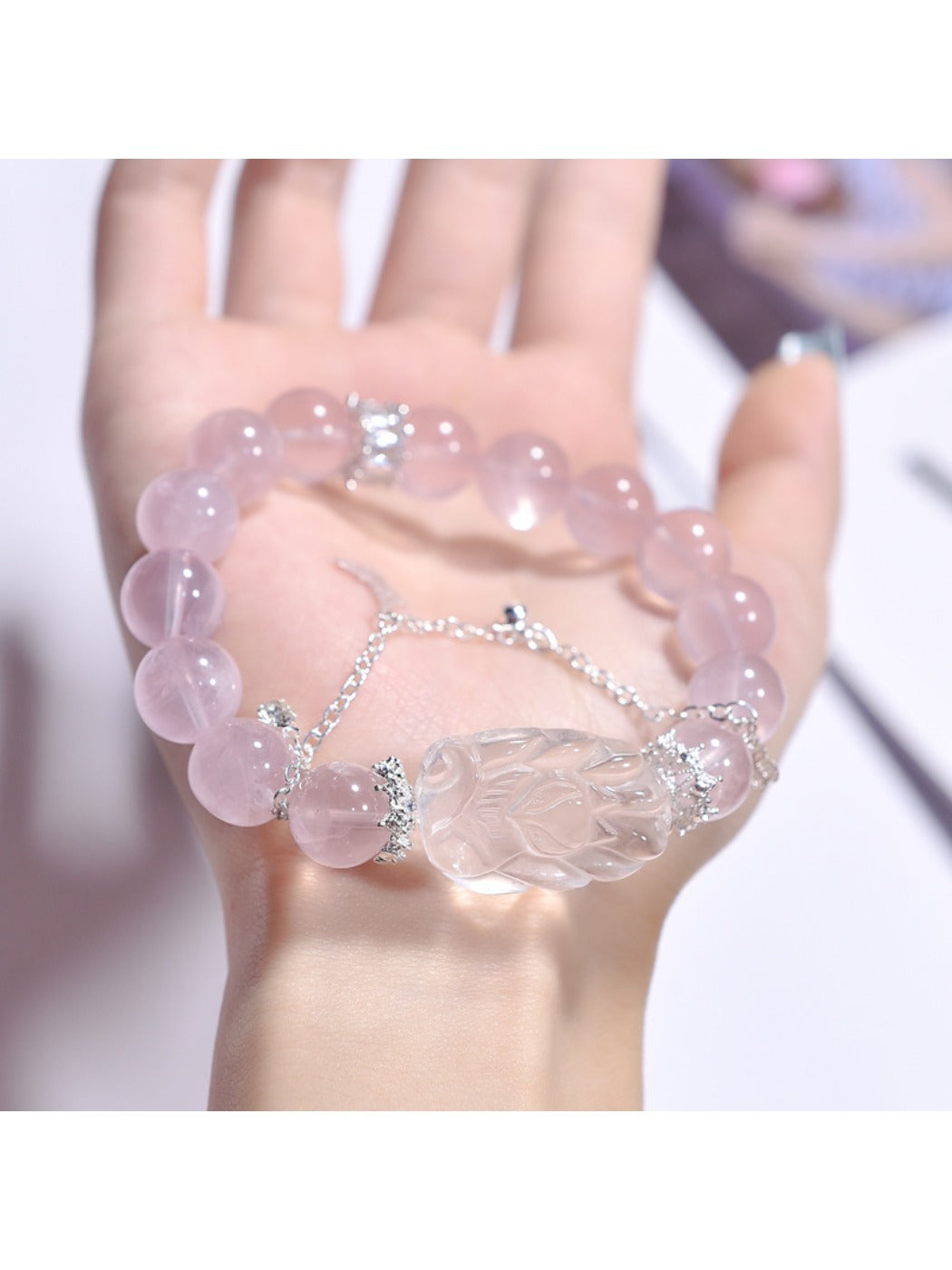 Side view of Lovra bracelet featuring pink crystal fox charm