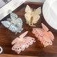 Side view of Beau butterfly hair claw clip highlighting curved shape and smooth finish