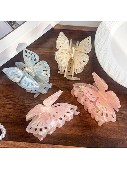 Side view of Beau butterfly hair claw clip highlighting curved shape and smooth finish