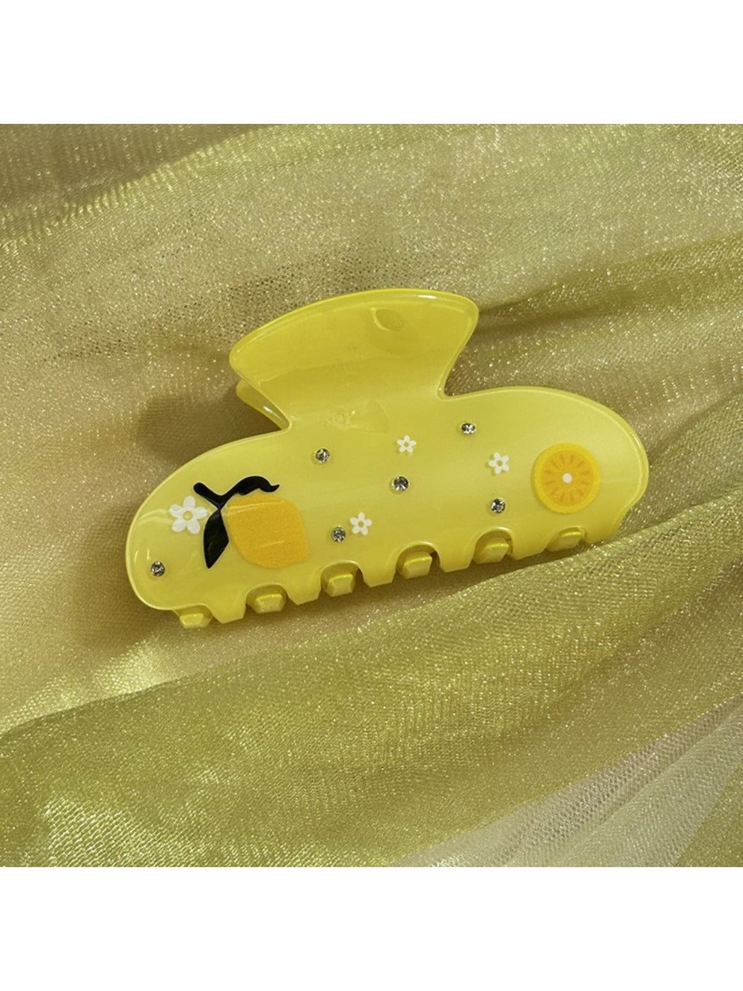 Beau floral crescent hair claw clip displayed on a white background
