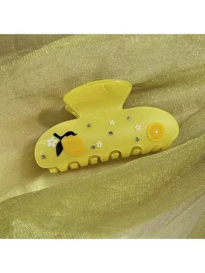 Beau floral crescent hair claw clip displayed on a white background