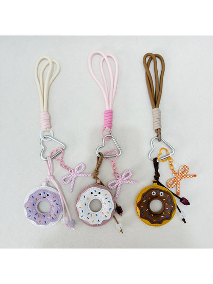 Side view of the donut keychain showing its thickness and texture