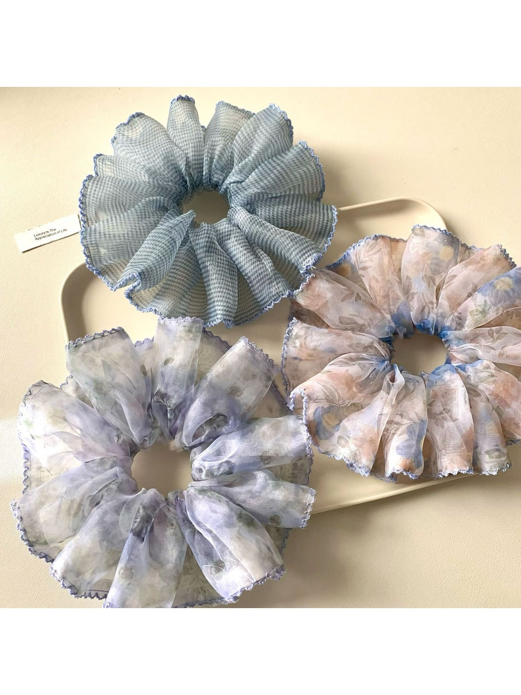 Set of vintage minimalist printed scrunchies in various colors on a white background