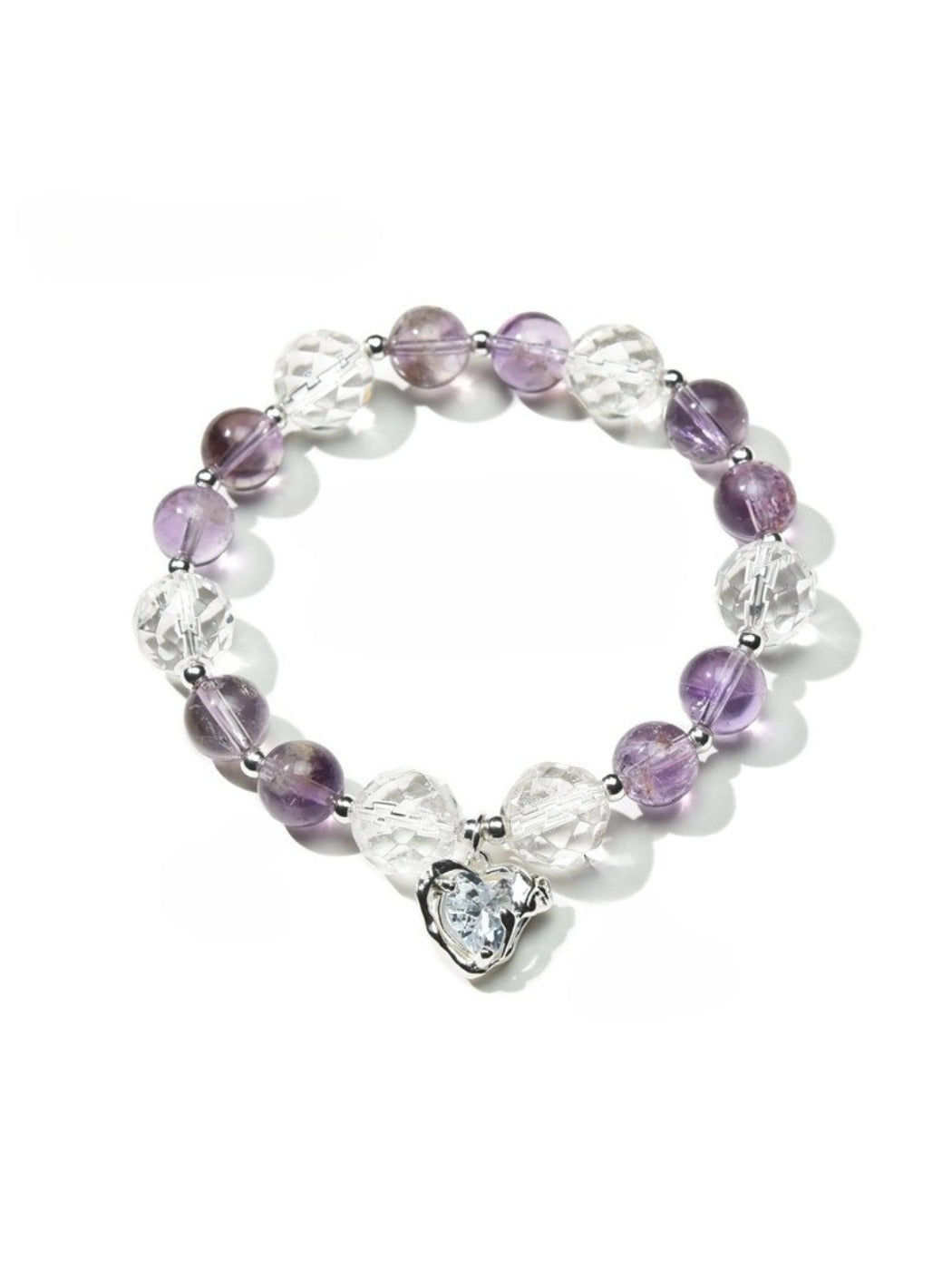 Model wearing Lovra amethyst beaded bracelet on wrist with soft lighting