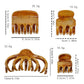 Beau textured shark hair claw clip held in hand, showing size and grip