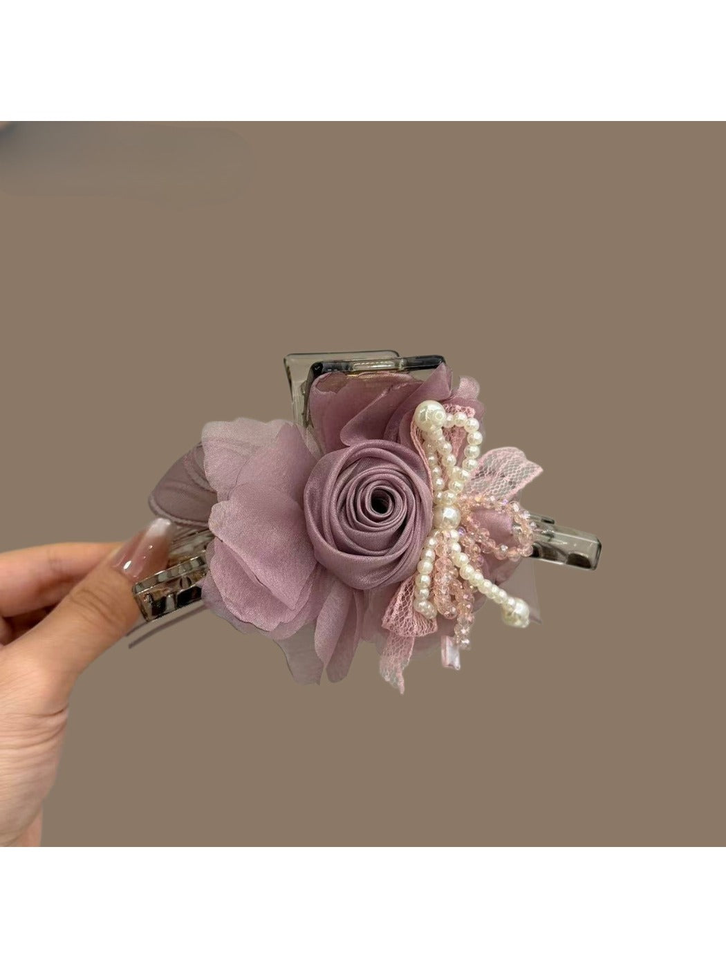 Beau tulle flower claw clip displayed open to show inner teeth