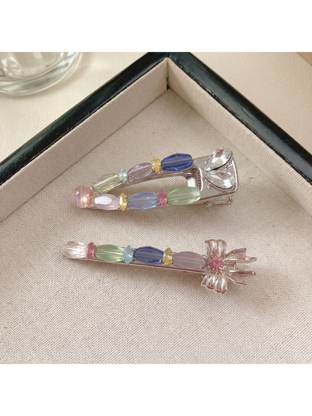 Beau colorful hair clip displayed from side angle, showing clip mechanism and petal details