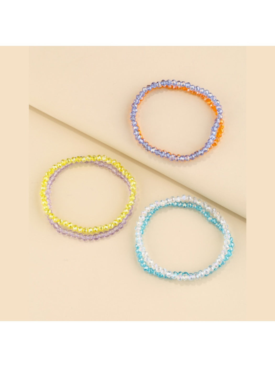 Lovra layered beaded bracelet styled with casual outfit on model's arm