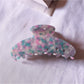 Beau tiny floral acetate claw clip shown with packaging and branding