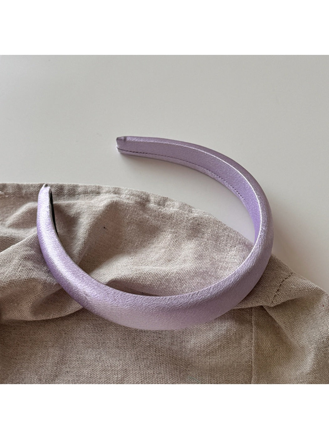 Purple wide edge headband styled with matching accessories