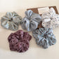 Gifty scrunchie with elegant floral and polka dot pattern on fabric