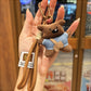 Fabric little bear keychain hanging from a backpack zipper