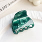 Beau elegant half moon claw clip displayed with natural light