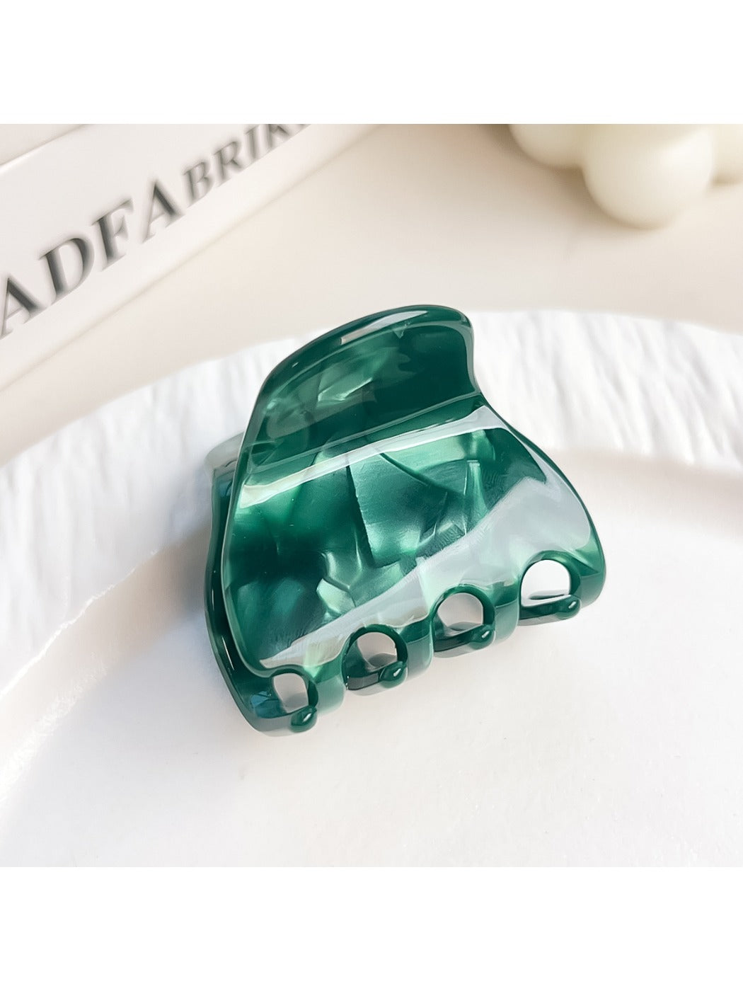 Beau elegant half moon claw clip displayed with natural light