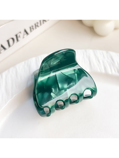 Beau elegant half moon claw clip displayed with natural light