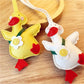 Little duck shaped keychain in yellow with a silver keyring attached