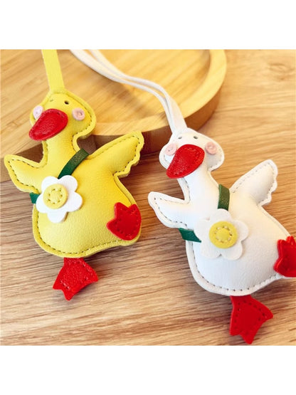 Little duck shaped keychain in yellow with a silver keyring attached