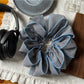 Gifty scrunchie styled in hair with visible checked pattern