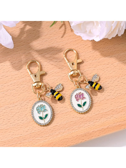 Alloy keychain with a detailed rose flower print on a circular pendant