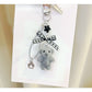 Keypus flocked bear keychain held in hand to show size and texture