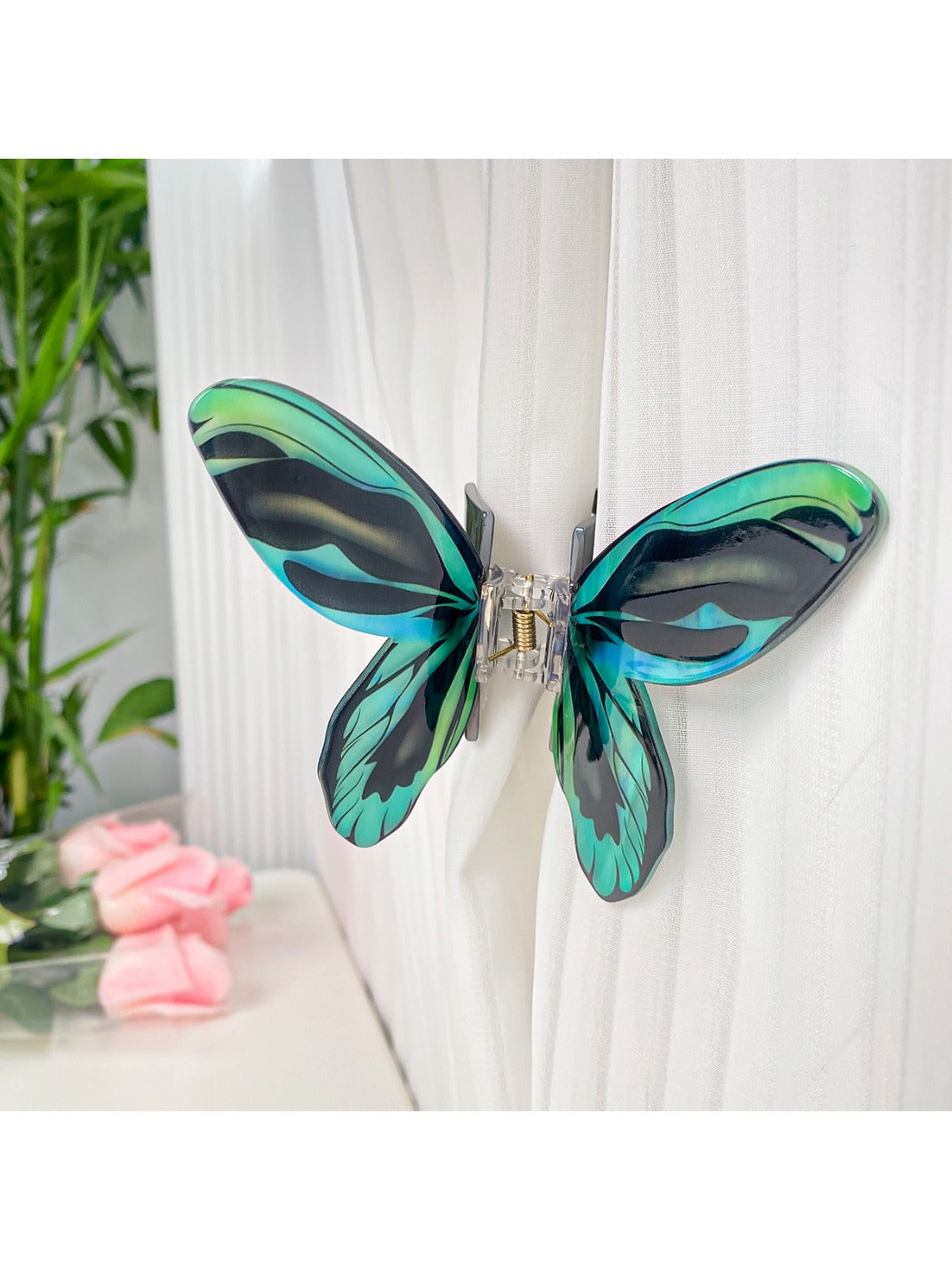 Beau butterfly hair claw clip in natural light highlighting glossy finish