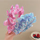 Side view of Gifty ruffle pleated fabric headband showing pleated texture