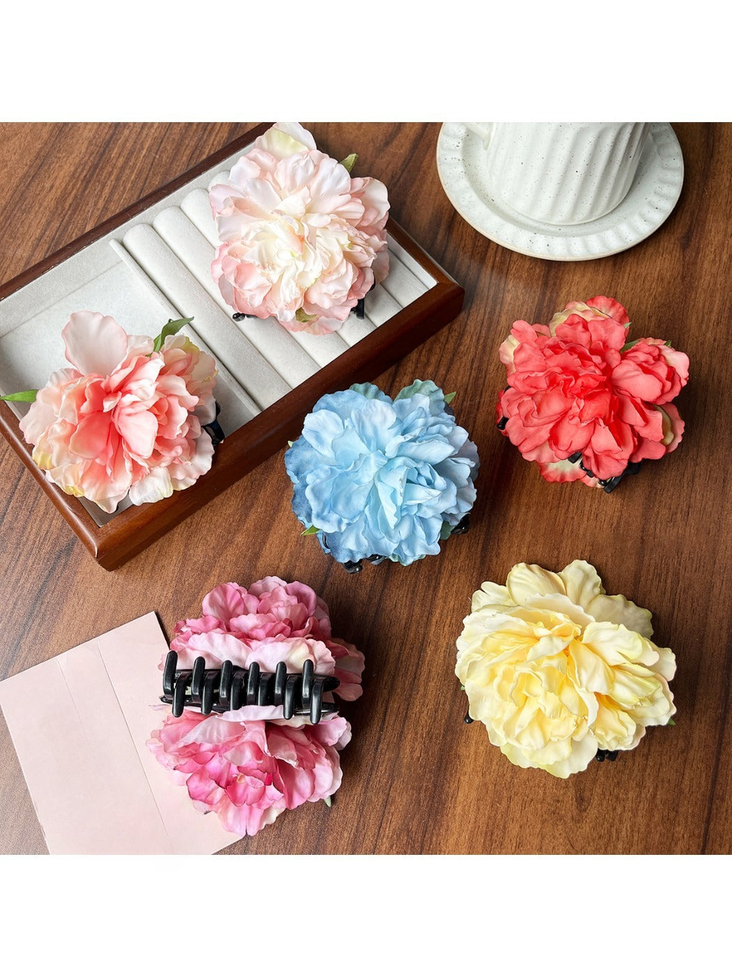 Close-up of Beau lifelike peony flower claw clip in soft pink with detailed petals