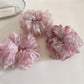 Top view of Gifty ditsy floral print hair scrunchie showing gathered fabric and elastic band